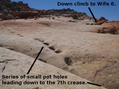 View of the series of pot holes leading down to the 7th crease in the slick rock.